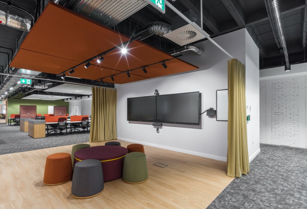 interior of refurbished office building showing video screen meeting area